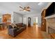 Cozy living room with a fireplace, hardwood floors, and a comfortable sofa at 5317 Burning Oak Ct, Raleigh, NC 27606