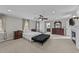 Large main bedroom with neutral carpet, decorative fireplace and plenty of natural light at 5317 Burning Oak Ct, Raleigh, NC 27606