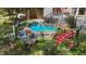 Backyard pool featuring a waterfall, stone surround, bridge and lush landscaping at 5317 Burning Oak Ct, Raleigh, NC 27606