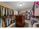 Spacious walk-in closet with custom shelving and ample storage space for clothing and accessories at 5317 Burning Oak Ct, Raleigh, NC 27606