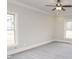 Spacious bedroom with carpet, neutral walls, and large windows at 6737 Dwight Rowlad Rd, Willow Springs, NC 27592