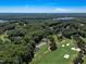 Aerial view of house and surrounding golf course at 76 Traceway N, Sanford, NC 27332