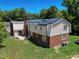 Aerial view showcasing home's solar panels and landscaping at 76 Traceway N, Sanford, NC 27332