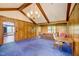 Spacious living room featuring vaulted ceilings and wood paneling at 76 Traceway N, Sanford, NC 27332