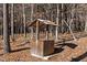 Wooden well located in wooded area at 7815 Dodsons Crossroads, Hillsborough, NC 27278