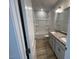Bathroom featuring double sinks with granite countertops, a shower, and ample space at 114 Arundel Dr, Archer Lodge, NC 27527