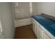 Clean bathroom with white cabinetry, modern fixtures, and shower-tub combination at 114 Arundel Dr, Archer Lodge, NC 27527