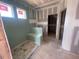 A modern bathroom under construction features a custom shower seat at 114 Arundel Dr, Archer Lodge, NC 27527