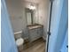 Bathroom featuring a vanity with granite countertops, mirror, and toilet at 114 Arundel Dr, Archer Lodge, NC 27527