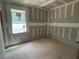 A bedroom under construction with natural light and ready for customization at 114 Arundel Dr, Archer Lodge, NC 27527