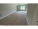Large bonus room with a window, perfect for recreation or a home office at 114 Arundel Dr, Archer Lodge, NC 27527