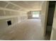 A large, unfinished bonus room with lots of natural light ready to be finished and personalized at 114 Arundel Dr, Archer Lodge, NC 27527