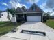 Beautifully maintained home with stone accents, a two-car garage, and mature trees at 114 Arundel Dr, Archer Lodge, NC 27527