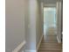 Inviting hallway with light gray walls and wood-look flooring leading into the home at 114 Arundel Dr, Archer Lodge, NC 27527