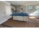 Open-concept kitchen with a spacious island and modern white cabinets at 114 Arundel Dr, Archer Lodge, NC 27527