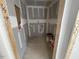 A compact laundry room awaits completion, showing the utility connections at 114 Arundel Dr, Archer Lodge, NC 27527