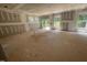 Spacious living room area showing construction in progress with natural light and access to the deck at 114 Arundel Dr, Archer Lodge, NC 27527
