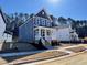 Two story home with a covered porch surrounded by newly-planted lawn at 136 Weavers Grove Dr, Chapel Hill, NC 27514