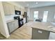 Kitchen with granite counters, stainless steel appliances, and gray cabinets at 170 Vega Loop, Sanford, NC 27330