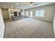 Open floor plan with carpeted living room and kitchen with granite counters at 170 Vega Loop, Sanford, NC 27330