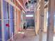An unfinished bathroom shows the framework, window, plumbing, and shower for a new residence at 203 Pond Vw Ct # 1, Fuquay Varina, NC 27526