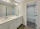 Double vanity bathroom features modern fixtures, spacious countertops and a tiled floor at 203 Pond Vw Ct # 1, Fuquay Varina, NC 27526