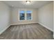 Bright bedroom with a large window and neutral carpet at 203 Pond Vw Ct # 1, Fuquay Varina, NC 27526