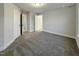 Large bedroom with neutral carpet, white trim and access to multiple closets at 203 Pond Vw Ct # 1, Fuquay Varina, NC 27526