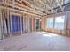 An unfinished bedroom shows the framework, windows, and plumbing for a new residence at 203 Pond Vw Ct # 1, Fuquay Varina, NC 27526