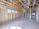 An unfinished primary bedroom shows the framework, windows, and plumbing for a new residence at 203 Pond Vw Ct # 1, Fuquay Varina, NC 27526
