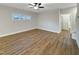 Bonus room features modern ceiling fan and wood-look floors at 203 Pond Vw Ct # 1, Fuquay Varina, NC 27526