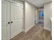 Bright hallway features neutral carpeting, white trim and access to bedrooms and closets at 203 Pond Vw Ct # 1, Fuquay Varina, NC 27526
