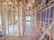 An unfinished hallway shows the framework, ceiling work, and plumbing for a new residence at 203 Pond Vw Ct # 1, Fuquay Varina, NC 27526
