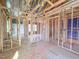 An unfinished hallway shows the framework, bathroom, and plumbing for a new residence at 203 Pond Vw Ct # 1, Fuquay Varina, NC 27526