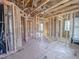 An unfinished hallway shows the framework, plumbing, and room framing for a new residence at 203 Pond Vw Ct # 1, Fuquay Varina, NC 27526