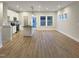 Open concept kitchen/living area featuring white cabinets and black countertops at 203 Pond Vw Ct # 1, Fuquay Varina, NC 27526