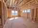 Bright, unfinished living room with wooden framework, and exposed ceiling at 203 Pond Vw Ct # 1, Fuquay Varina, NC 27526