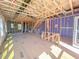Bright, unfinished living room with wooden framework, stairs, and exposed ceiling at 203 Pond Vw Ct # 1, Fuquay Varina, NC 27526