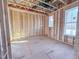 Bright, unfinished living room with wooden framework, and exposed ceiling at 203 Pond Vw Ct # 1, Fuquay Varina, NC 27526