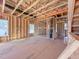 Spacious unfinished living room showcasing wooden framework and exposed ceiling at 203 Pond Vw Ct # 1, Fuquay Varina, NC 27526