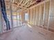 Spacious unfinished living room showcasing wooden framework and exposed ceiling at 203 Pond Vw Ct # 1, Fuquay Varina, NC 27526