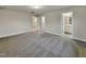 Spacious main bedroom with neutral carpet and access to the en suite bathroom at 203 Pond Vw Ct # 1, Fuquay Varina, NC 27526