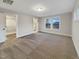 This main bedroom boasts neutral carpet, natural light, and an en suite bathroom at 203 Pond Vw Ct # 1, Fuquay Varina, NC 27526