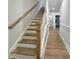 Staircase with wood stairs and white trim at 203 Pond Vw Ct # 1, Fuquay Varina, NC 27526