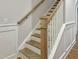 Stairway with wood stairs, white risers, and matching handrail and banister at 203 Pond Vw Ct # 1, Fuquay Varina, NC 27526