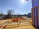 Balcony view framing a community area and lake, highlighting the outdoor aspects and serene neighborhood setting at 205 Pond Vw Ct # 2, Fuquay Varina, NC 27526