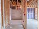 Exposed framing showing tub and shower unit, and construction materials, providing a glimpse of an unfinished bathroom at 205 Pond Vw Ct # 2, Fuquay Varina, NC 27526