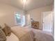 Relaxing bedroom featuring carpet, dresser, and a door leading to the outdoor area at 205 Pond Vw Ct # 2, Fuquay Varina, NC 27526