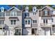 Charming townhouse featuring varied architectural styles and attached garages for modern convenience at 205 Pond Vw Ct # 2, Fuquay Varina, NC 27526