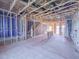 Partially framed living room showcasing the layout with stair access and potential for a spacious open plan at 205 Pond Vw Ct # 2, Fuquay Varina, NC 27526